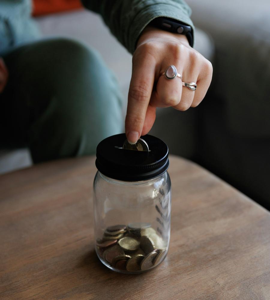 putting money in a jar